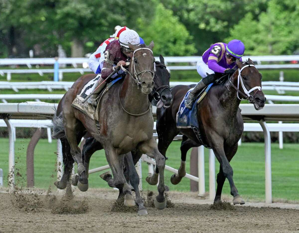 Epicenter, left, with jockey Joel Rosario, wins the 59th running of the Jim Dandy at Saratoga Race Course on Saturday, July 30, 2022.