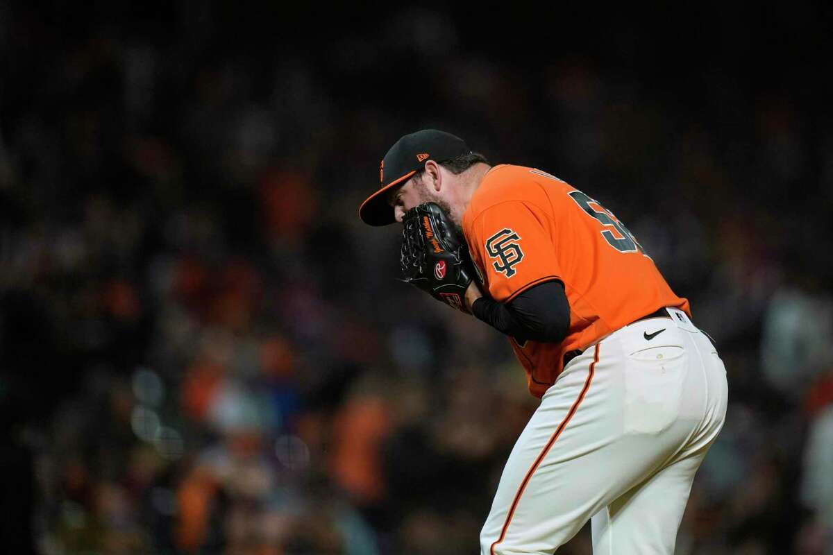 San Francisco Giants relief pitcher Dominic Leone reacts after a double play with the bases during the seventh inning of the team's baseball game against the Chicago Cubs in San Francisco, Friday, July 29, 2022. (AP Photo/Godofredo A. Vásquez)