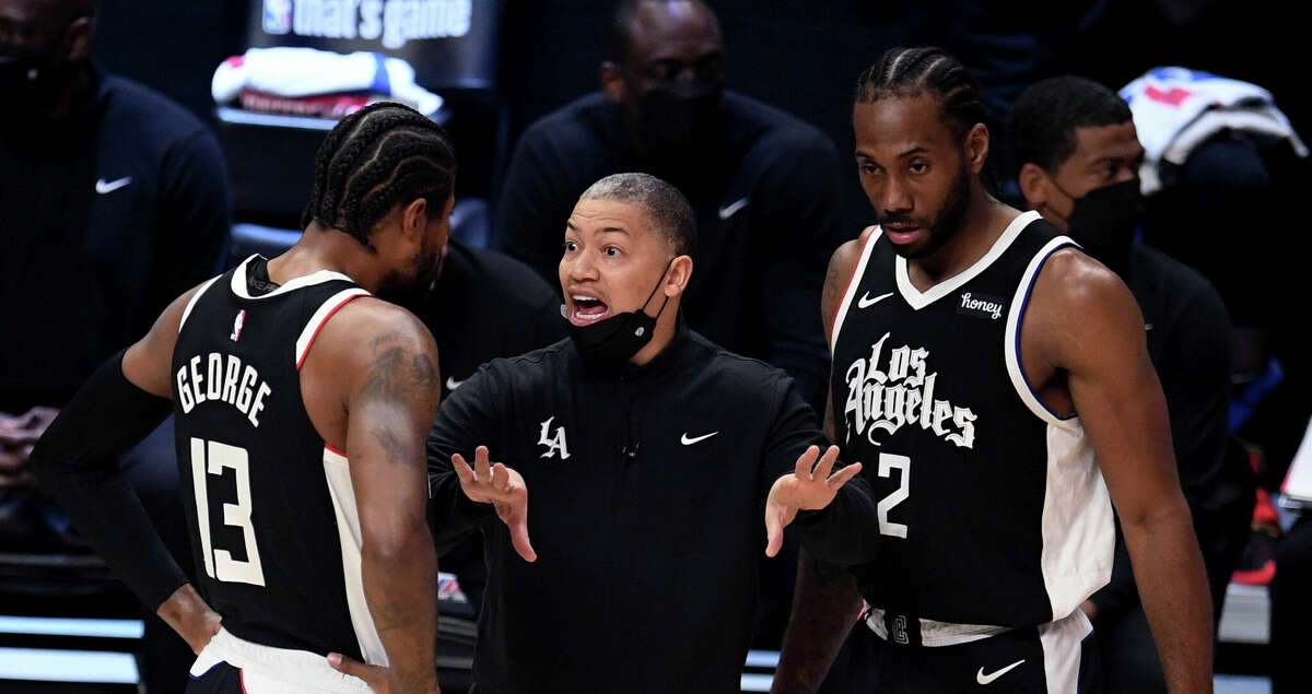 Los Angeles Clippers coach Tyronn Lue talks with Paul George, left, and Kawhi Leonard during the first half of Game 3 against the Utah Jazz in an NBA basketball second-round playoff series in Los Angeles on Saturday, June 12, 2021. (Keith Birmingham/The Orange County Register via AP)