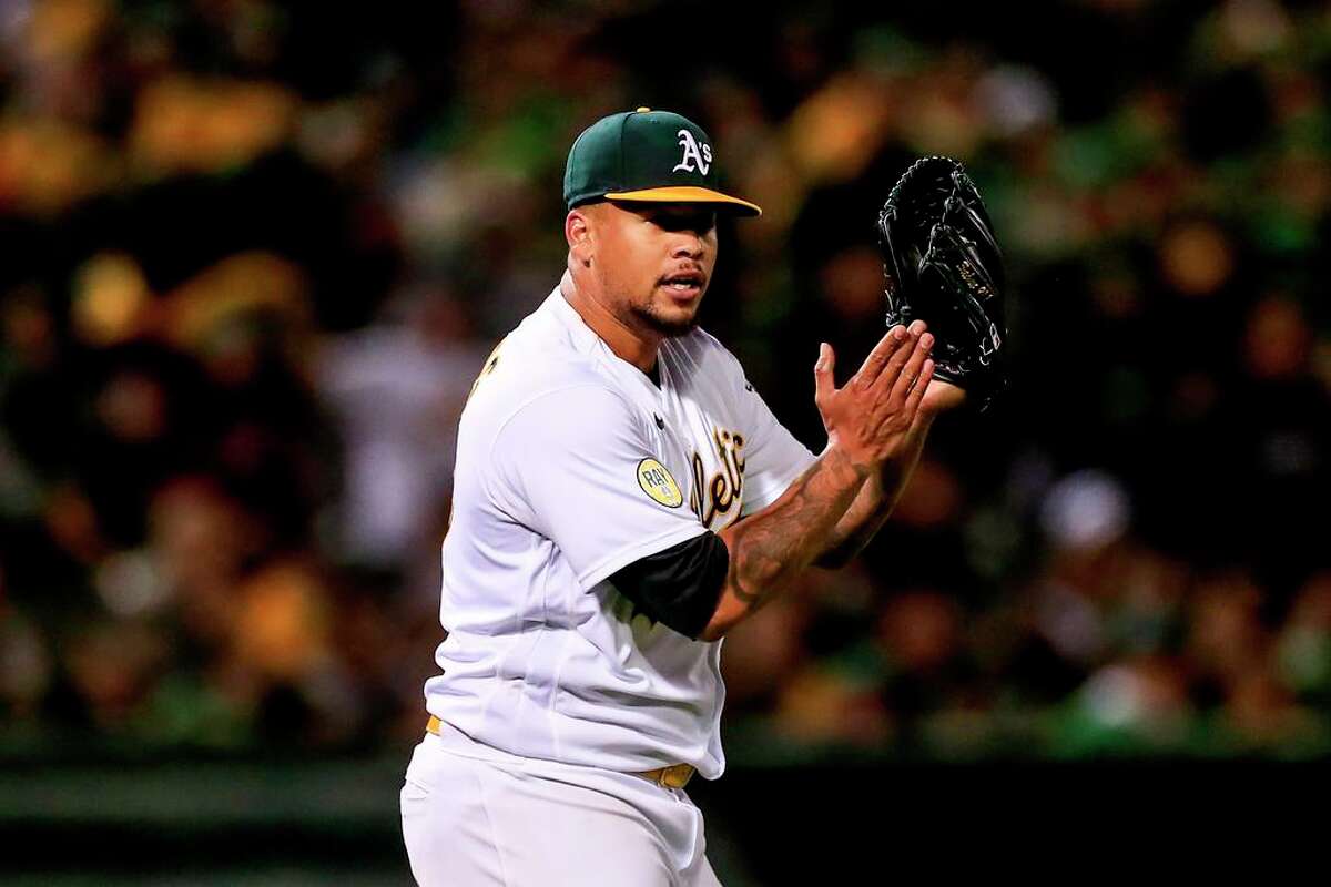 OAKLAND, CALIFORNIA - APRIL 18: Oakland Athletics' Frankie Montas (47) applauds after Oakland Athletics' Billy McKinney (28) threw out a runner at home against the Baltimore Orioles in the sixth inning at the Coliseum in Oakland, Calif., Monday, April 18, 2022. (Shae Hammond/Bay Area News Group/TNS)