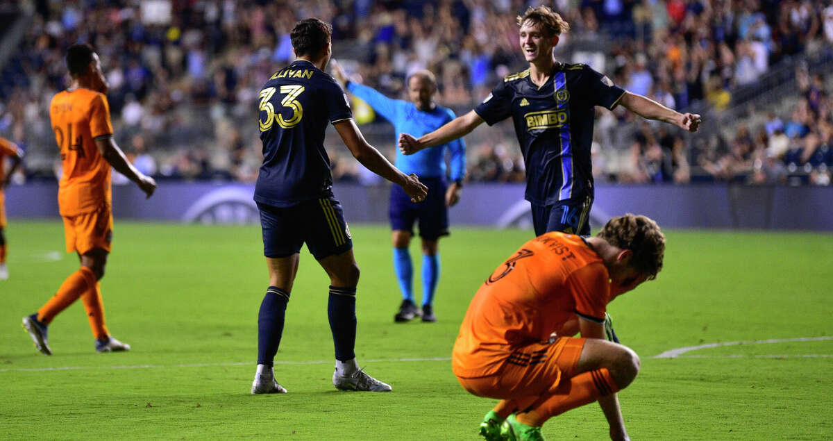 Philadelphia Union's Quinn Sullivan (33) celebrates with Jack McGlynn, upper right, after scoring a goal during the second half of an MLS soccer match against the Houston Dynamo, Saturday, July 30, 2022, in Chester, Pa. (AP Photo/Derik Hamilton)