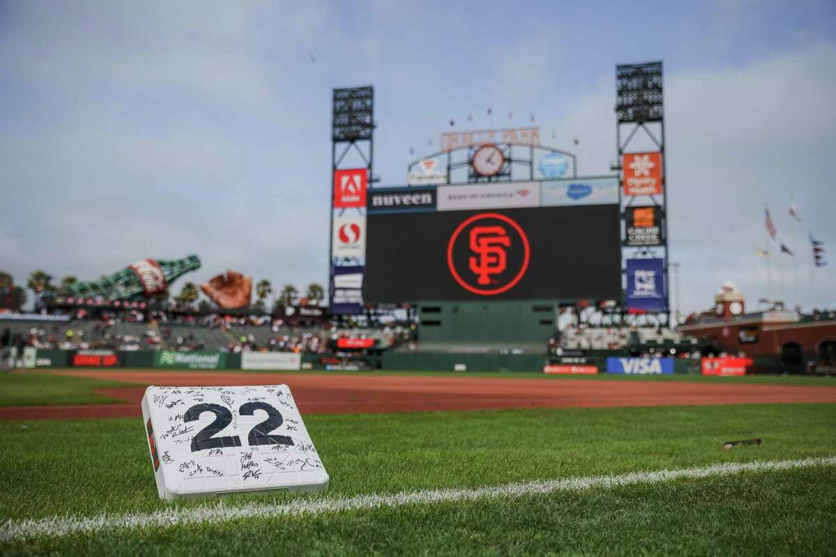 A commemorative first base plate signed by Giants players at Oracle Park in San Francisco , Calif., on Saturday, July 30, 2022. The San Francisco Giants are retiring Will Clark’s number 22.