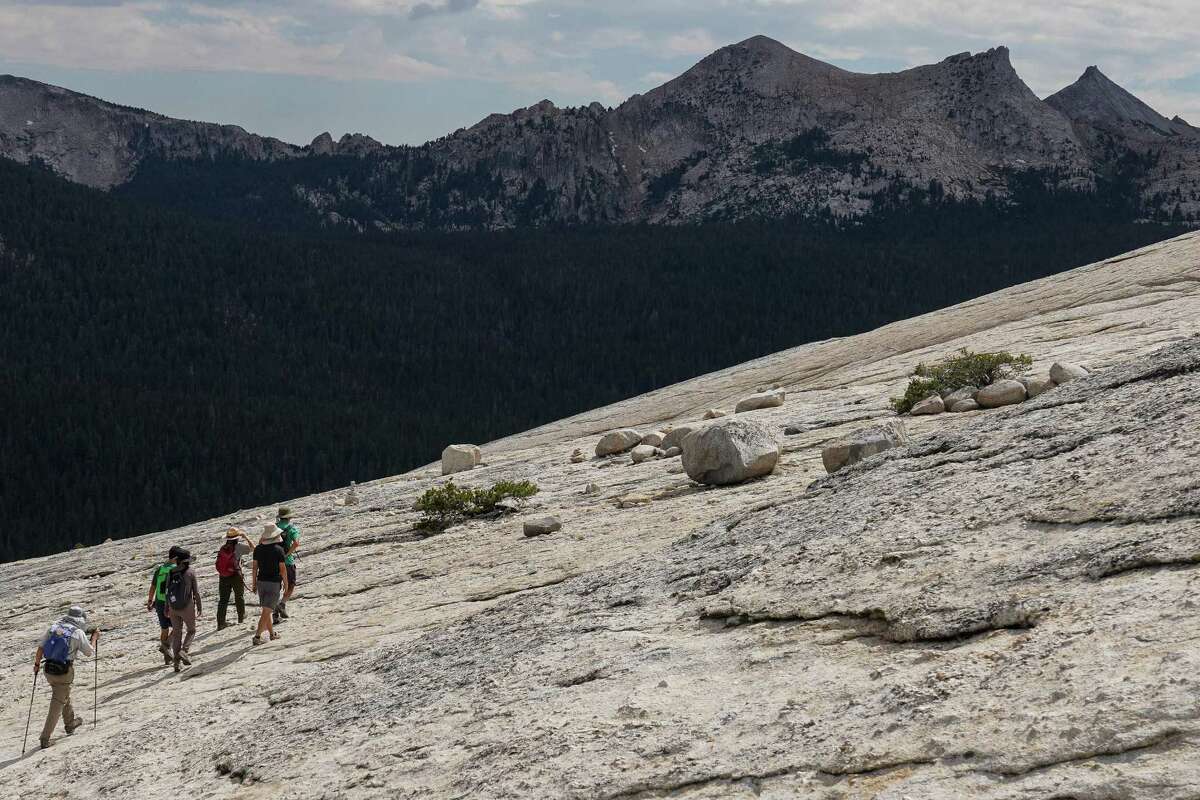 Ranger Yenyen Chan leads hikers up Lembert Dome in Yosemite National Park.