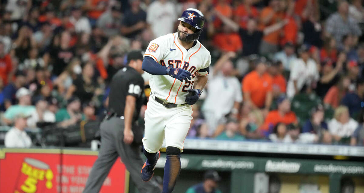 Houston Astros' Jose Altuve (27) reacts as he lined out to Seattle Mariners center fielder Adam Frazier (26) during the ninth inning of an MLB baseball game at Minute Maid Park on Saturday, July 30, 2022 in Houston.