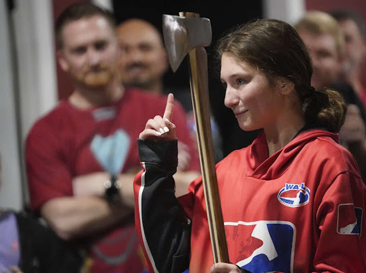 Josselyn Allen, 14, of Jerseyville concentrates before throwing her axe at a competition. Allen will attend World Axe Throwing Association's Commissioner's Cup in North Carolina on Friday, which will be broadcast on ESPN's Ocho.