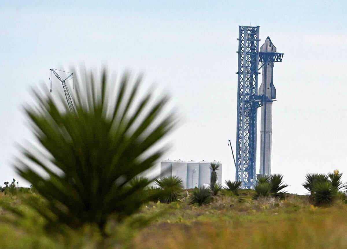 The SpaceX Starship spacecraft on a rocket booster at the company's launch facility in Boca Chica, Texas.