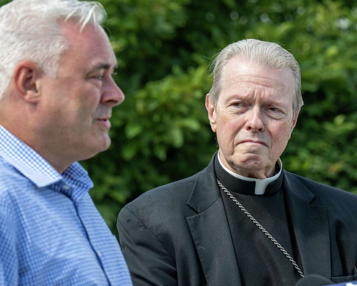 Stephen Mittler, who says he was a victim of clergy sex abuse, speaks to the press at Corpus Christi Church in Round Lake, NY, on Sunday, July 31, 2022, while Albany Bishop Edward Scharfenberger listens. (Jim Franco/Special to the Times Union)