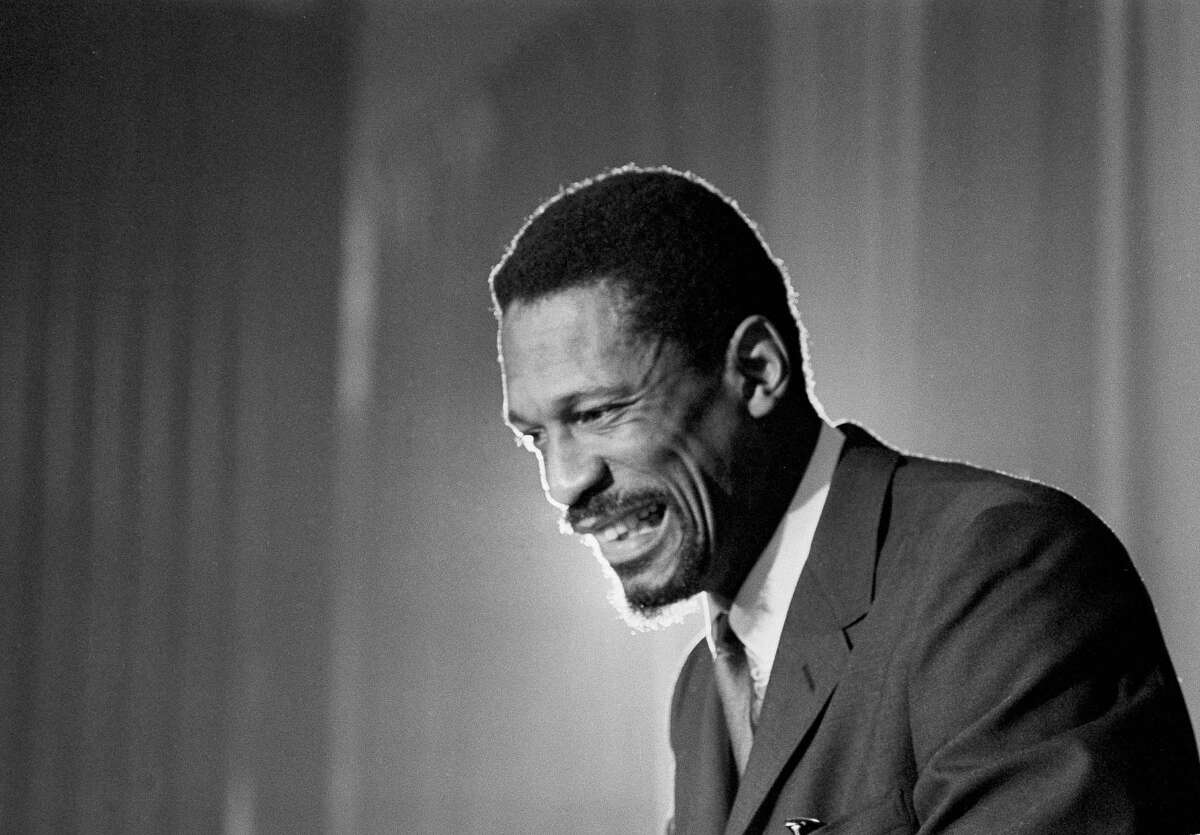 Bill Russell grins at announcement that he had been named coach of the Boston Celtics basketball team, April 18, 1966. Russell, 32, former University of San Francisco star becomes first black coach in National Basketball Association history. (AP Photo)