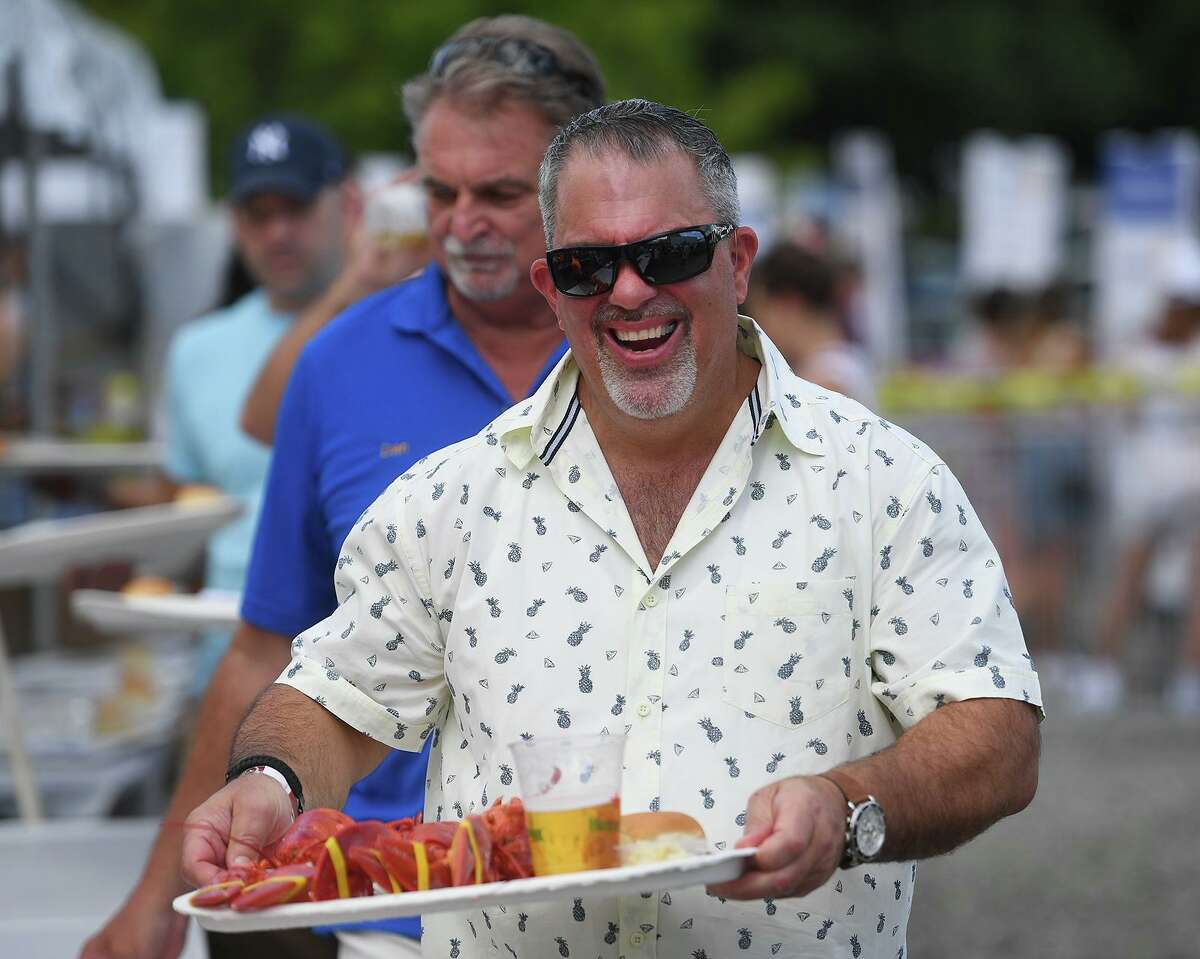 Jack Abate, of West Haven, is excited for his lobsters at the annual Milford Rotary Lobster Bake at Lisman Landing in Milford, Conn. on Saturday, July 30, 2022.