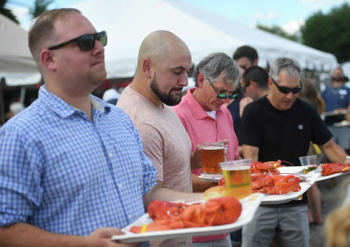 Lobster, corn on the cob, and beer are on the menu at the annual Milford Rotary Lobster Bake at Lisman Landing in Milford, Conn. on Saturday, July 30, 2022.