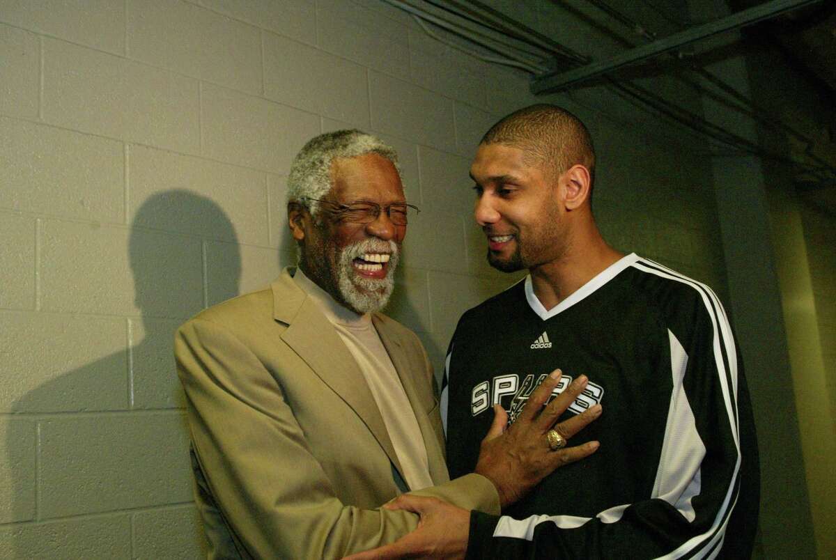 Bill Russell and Tim Duncan of the Spurs share a laugh during the 2009 NBA All-Star Weekend at US Airways Center in Phoenix.