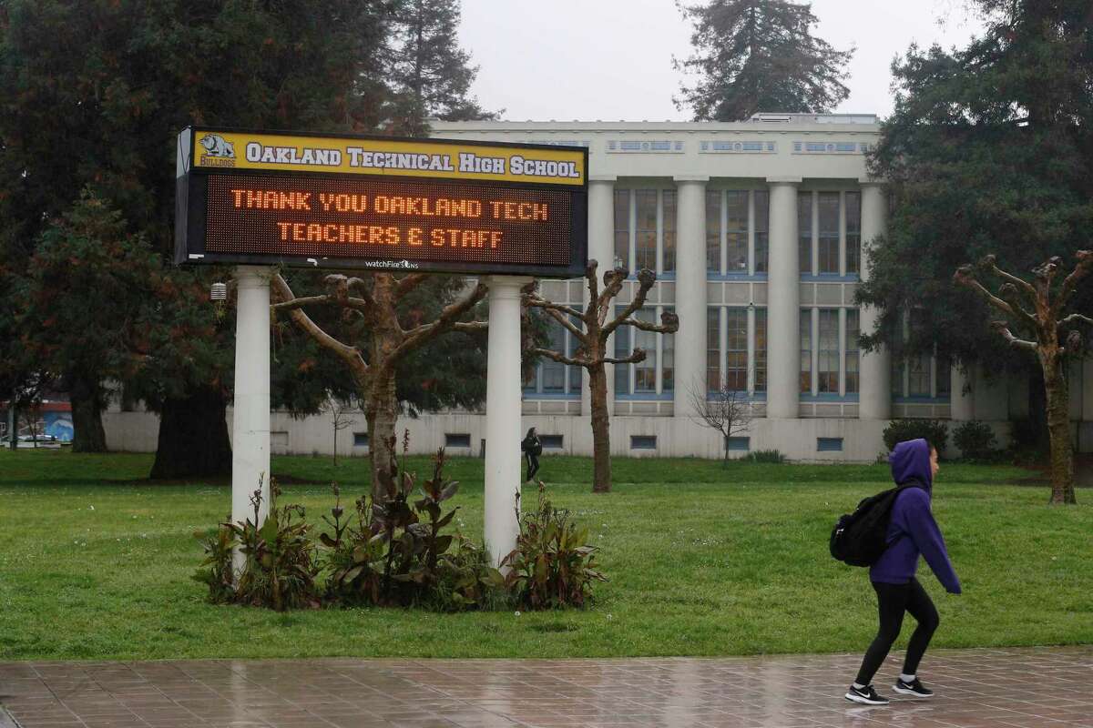A sign in front of Oakland Technical High School thanks teachers and staff in 2019. A shooting at the school injured three people, sources said.