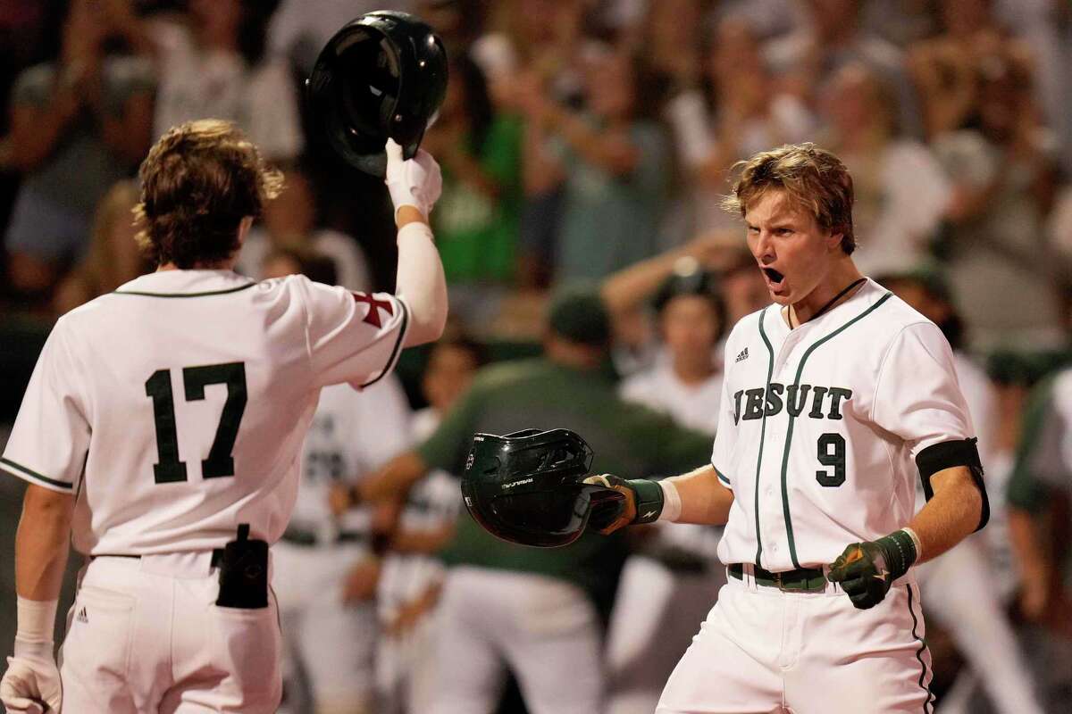 Strake Jesuit’s Trey Duffield (9) celebrates his game-tying solo home run with Shane Pellegrino(17) during the sixth inning of Game 2 of the Region III-6A Championship high school baseball playoff series against Ridge Point, Friday, June 3, 2022, in Houston.