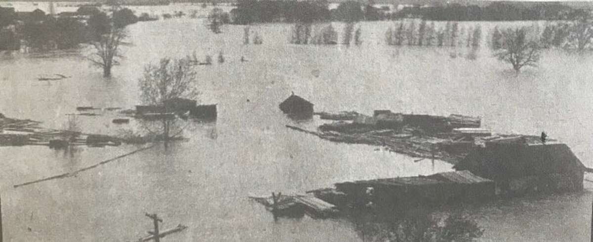 A scene from the flood of 1912, where the Chippewa and Tittabawassee rivers come together and where the Tridge is located today.