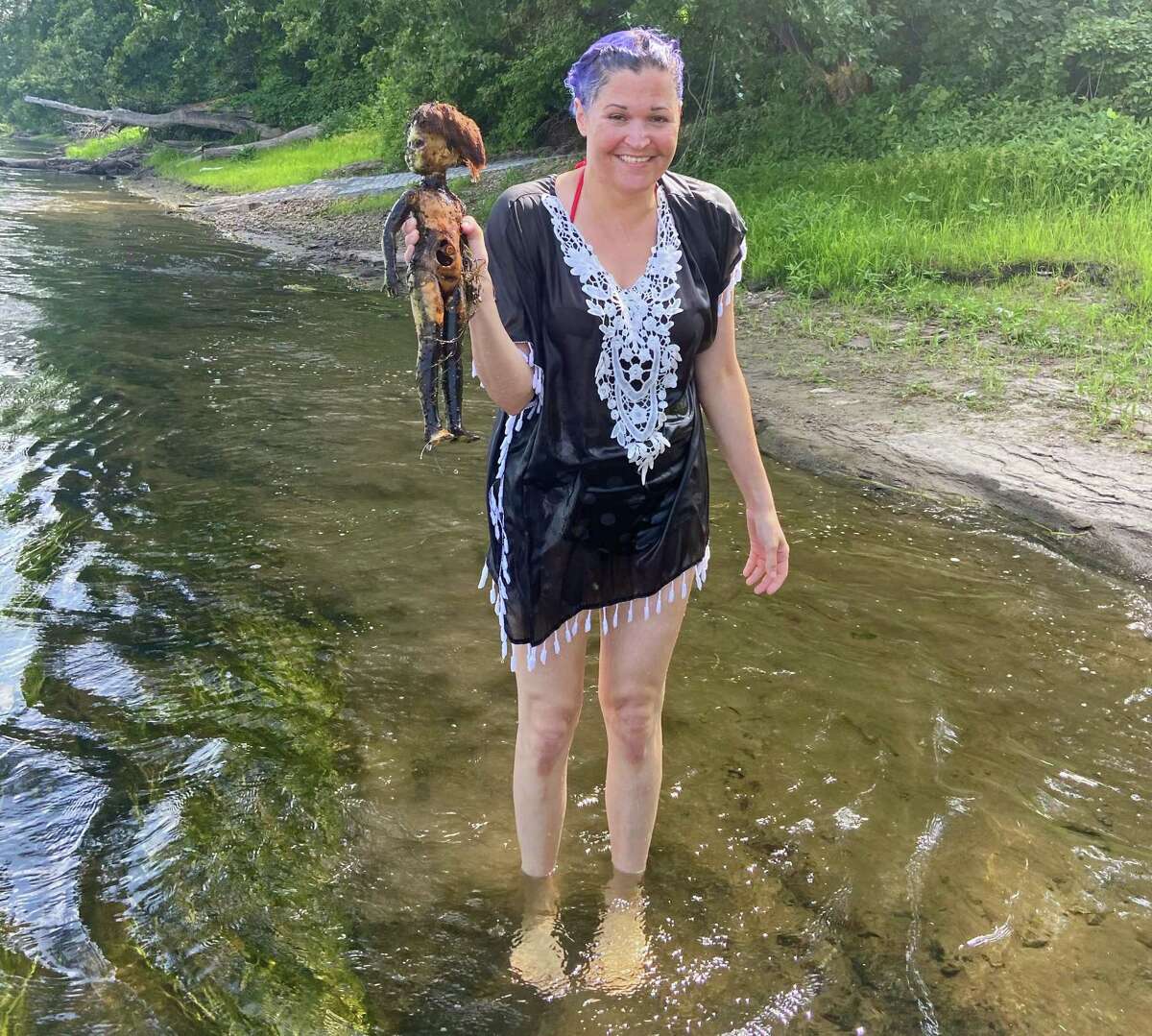 Sally Grossman with the doll she fished out of the Connecticut River.