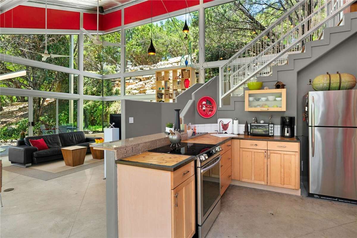 The 1,638 square foot home has two bedrooms, two baths, panoramic decks and patios with long-distance views on all four sides.