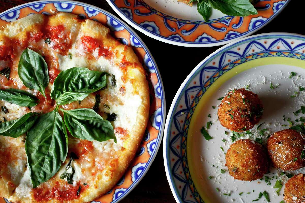 The Pizza Margherita (left) and the Arancini Fried Risotto Parmigiano (right), at Grappino di Nino. The Vincent Mandola Family Restaurants announced Monday that after 45 years of service it will close Nino’s, Vincent’s, and Grappino di Nino on Aug. 5.
