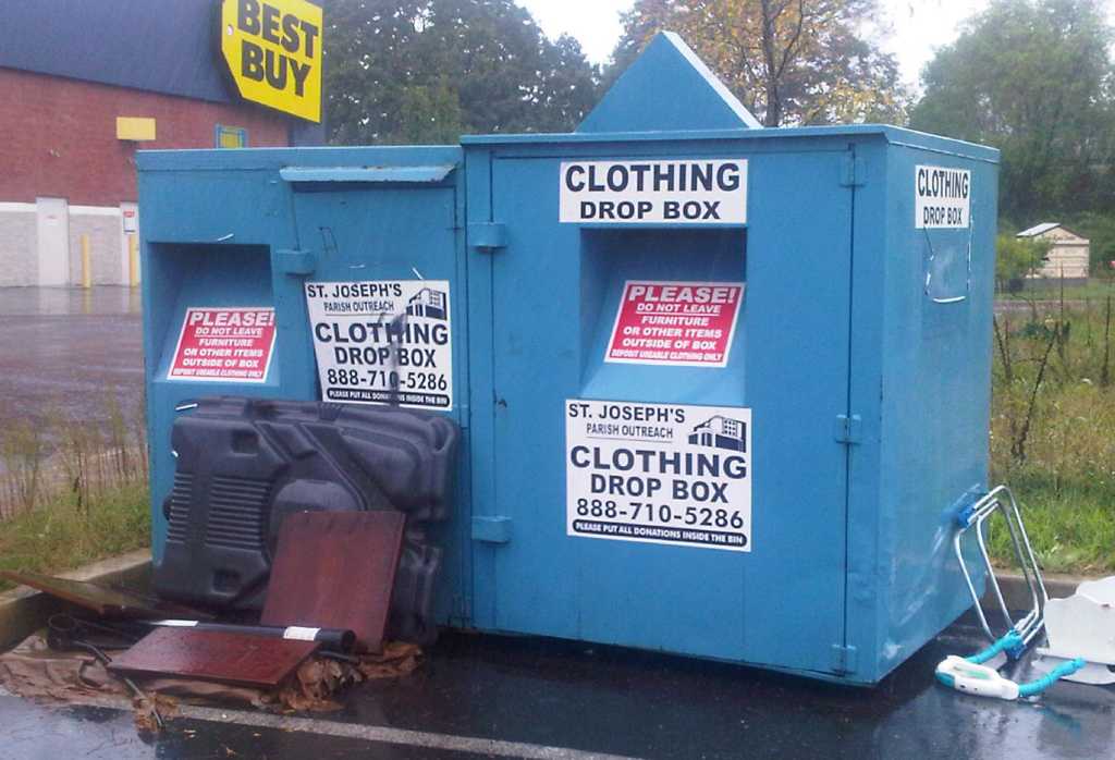 Used clothing donation boxes cluttering the city