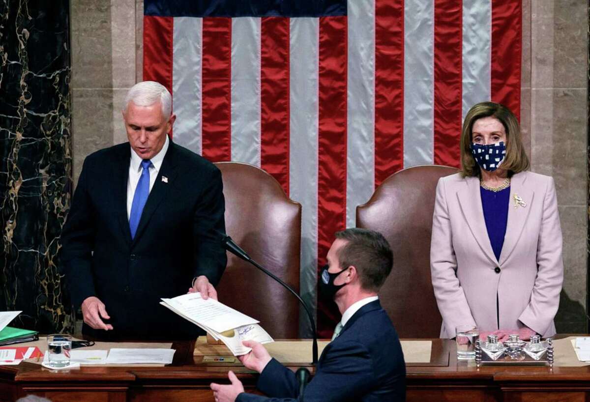 Vice President Mike Pence and House Speaker Nancy Pelosi preside over a joint session of Congress to certify the 2020 Electoral College results after supporters of President Donald Trump stormed the Capitol earlier in the day on Capitol Hill in Washington, D.C., on Jan. 6, 2021.