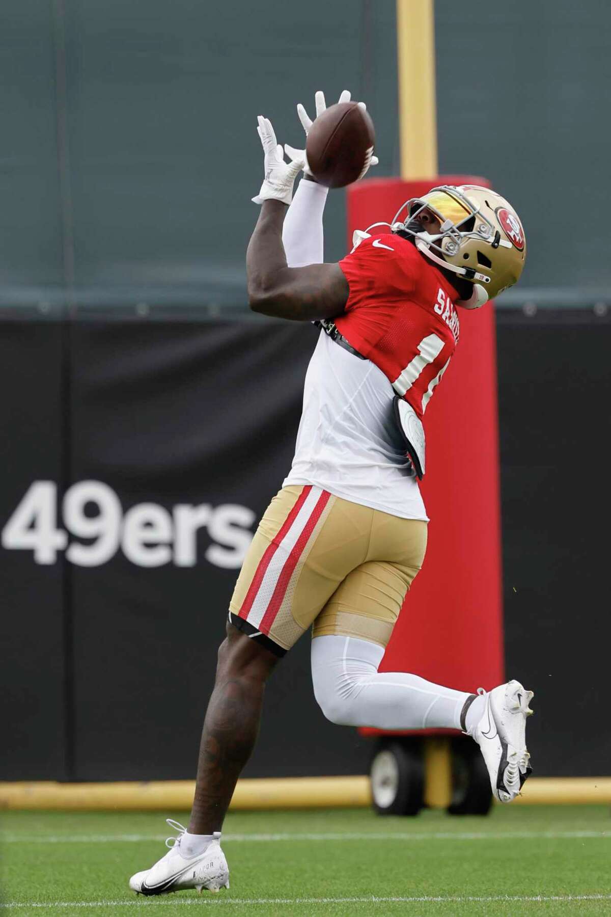 49ers wide receiver Deebo Samuel reaches for a pass during training camp in Santa Clara on Monday.