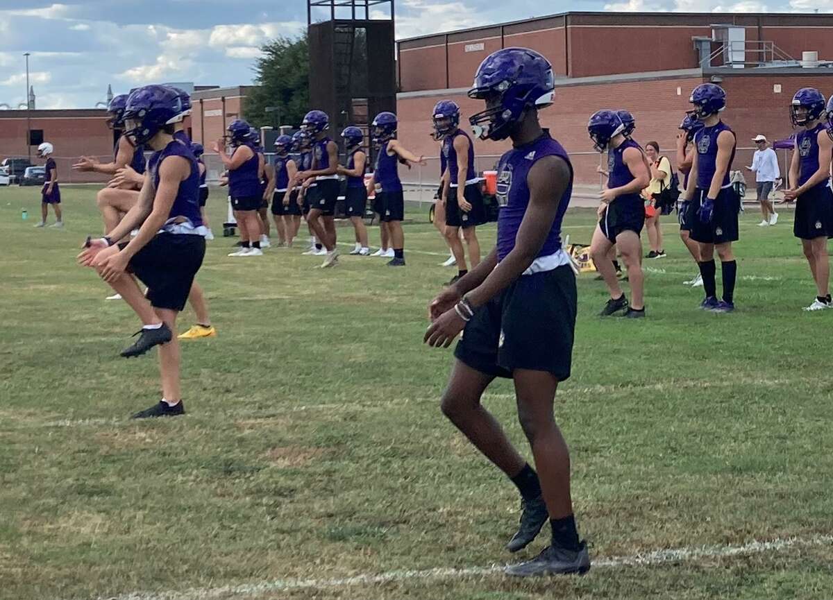 Montgomery football players warm up during the first day of football practice, Monday August 1, 2022, at Montgomery High School.