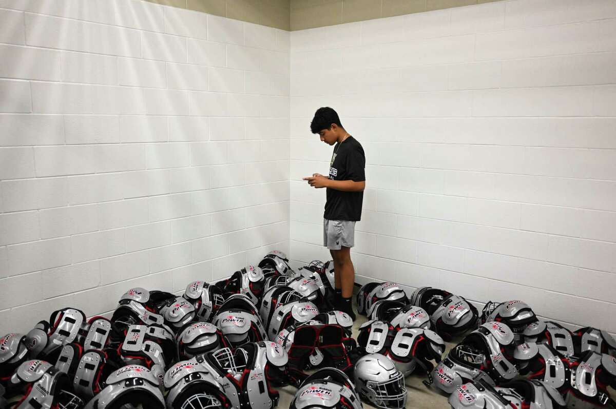 A Sotomayor football player finds the new pads and helmets are ready to be picked up by players at the newest school in Northside ISD. It’s one of four new area high schools teams competing at the varsity level this season.