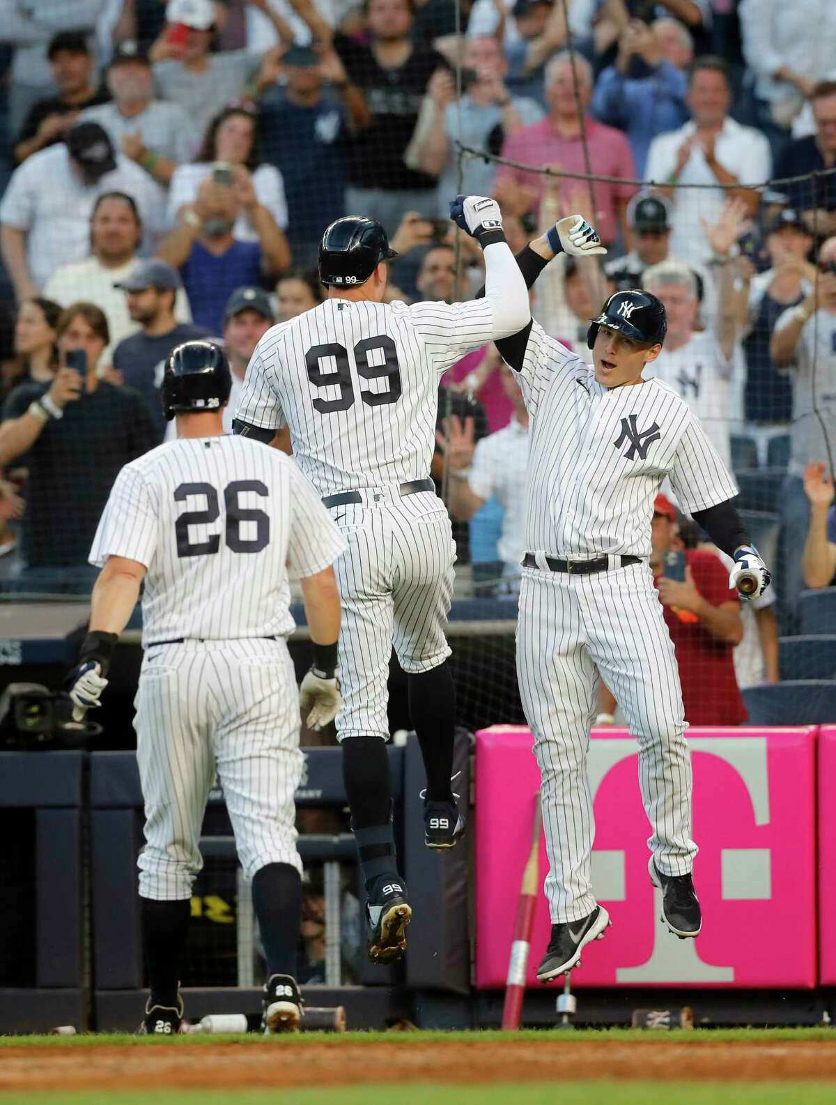 NEW YORK, NEW YORK - AUGUST 01: Aaron Judge #99 of the New York Yankees celebrates his second inning two run home run against the Seattle Mariners with teammates Anthony Rizzo #48 and DJ LeMahieu #26 at Yankee Stadium on August 01, 2022 in New York City. (Photo by Jim McIsaac/Getty Images)