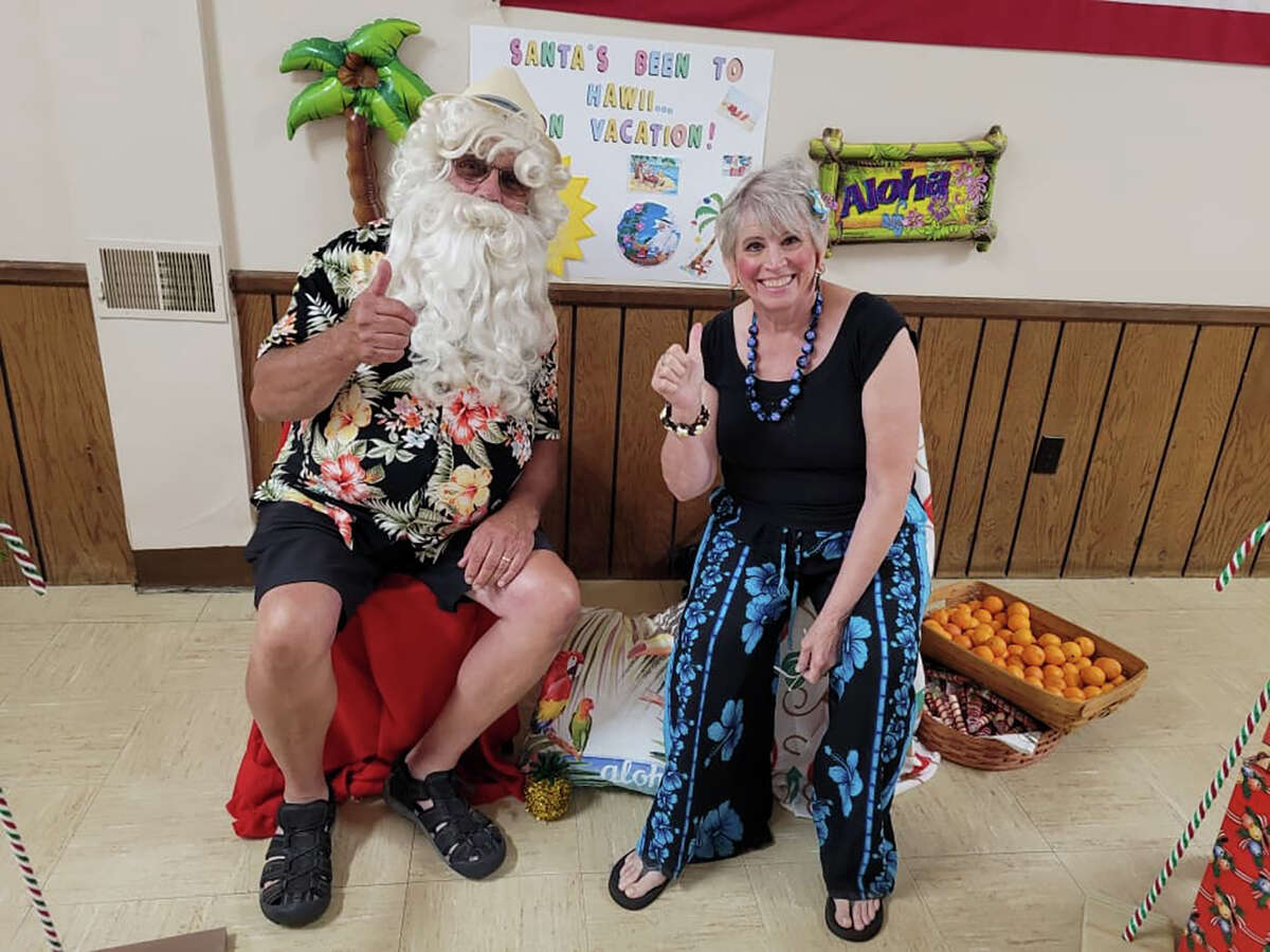 Santa and his helper hit the Luther Lions Club to raise money to continue supporting Feeding America at Luther Lions Club once a month.