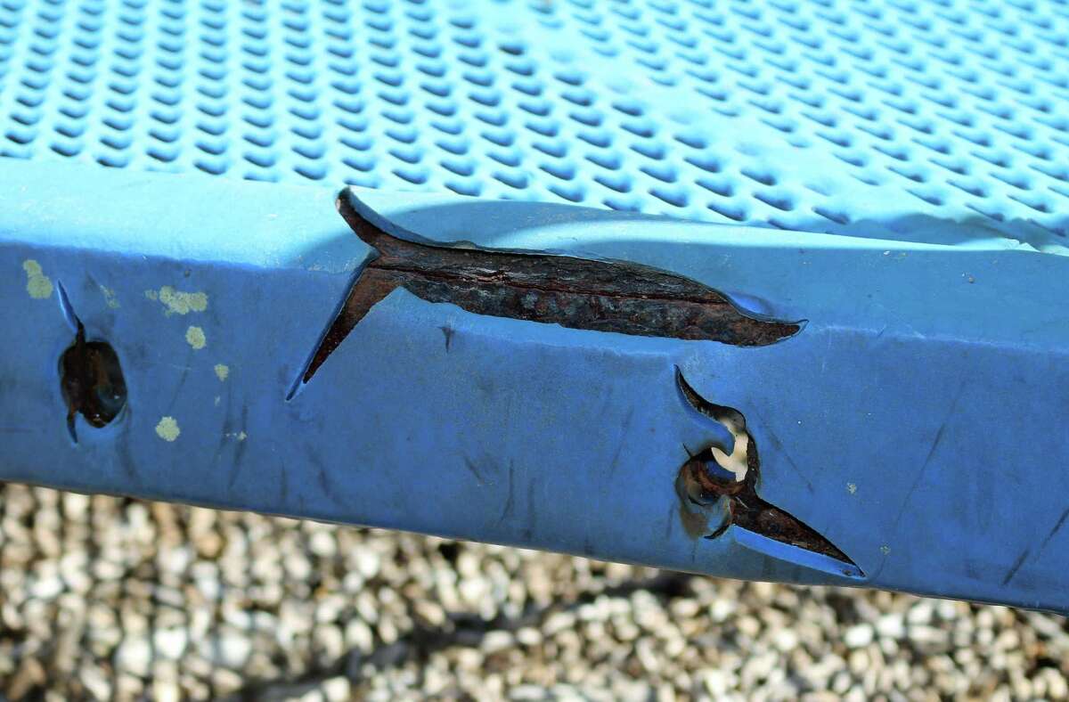 Rust has eaten a hole in a section of  a playground apparatus at League City's Bayridge Park.