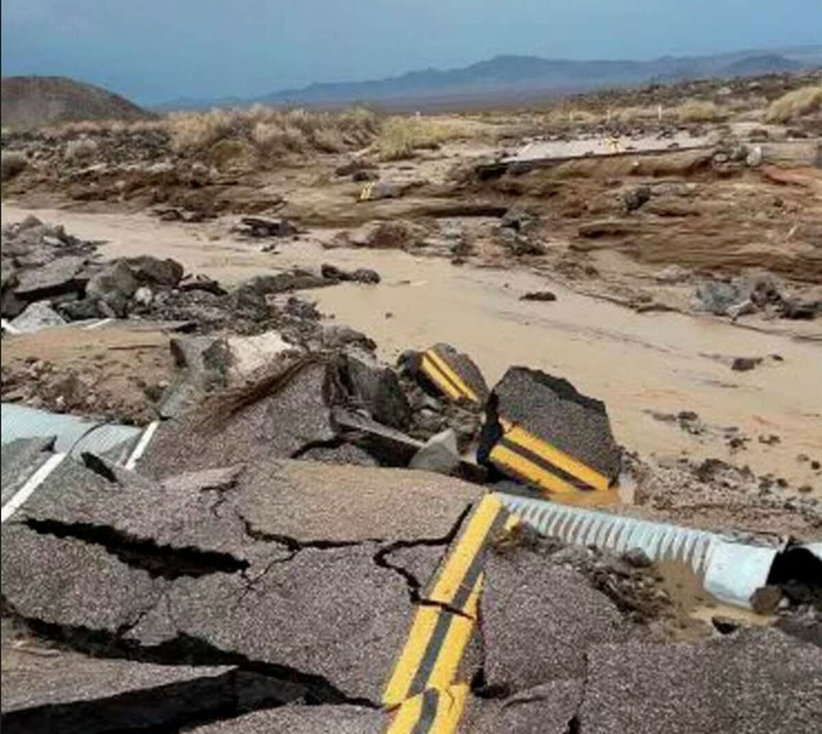 The damaged intersection of Kelbacker Road and Mojave Road in the Mojave National Preserve, Calif., Sunday, July 31, 2022. 
