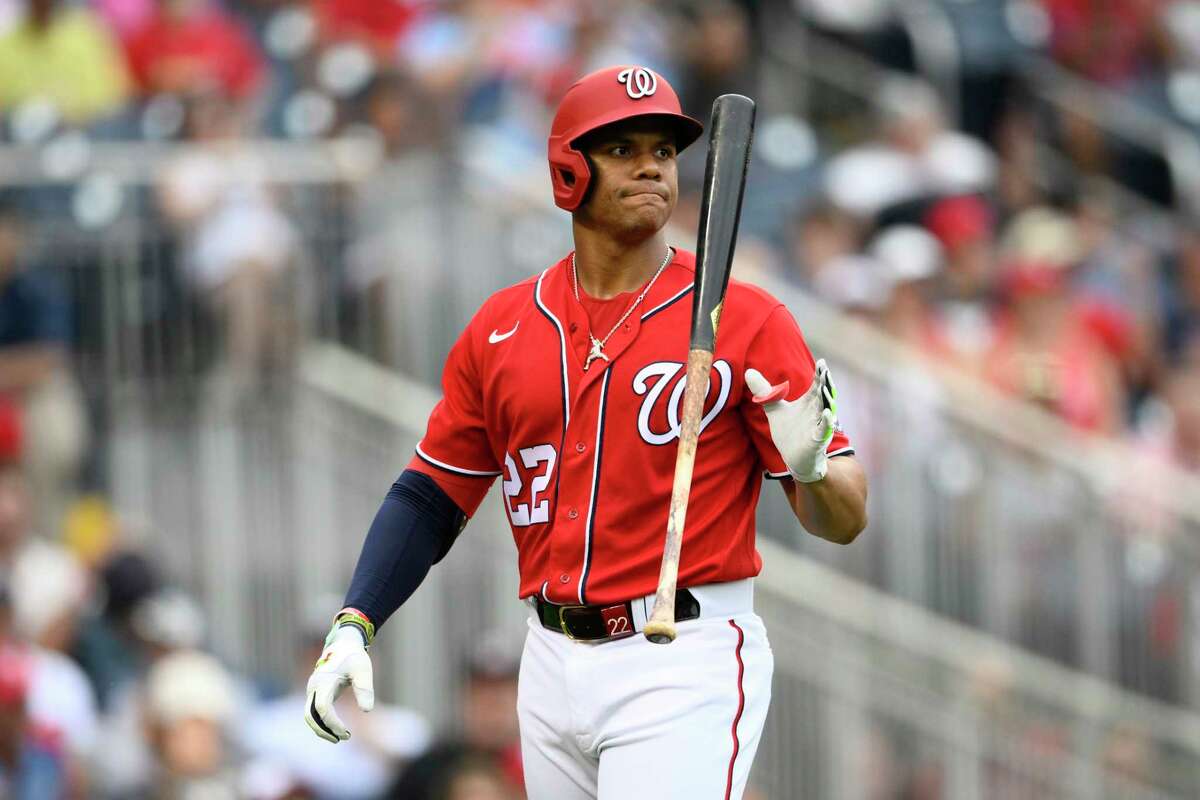Washington Nationals' Juan Soto reacts as he walks back to the dugout after he was called out on strikes during the ninth inning of a baseball game against the St. Louis Cardinals, Sunday, July 31, 2022, in Washington.