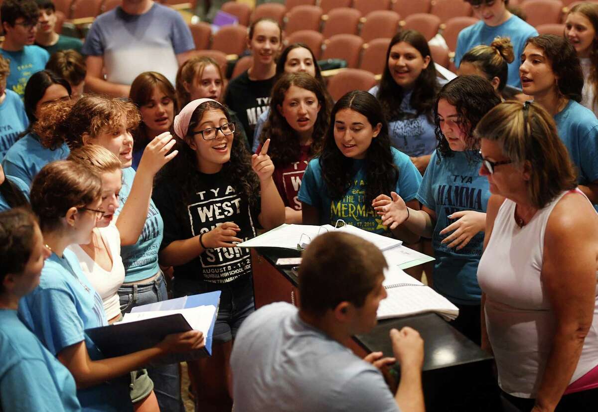 The cast rehearse songs in preparation for the August 4 opening of the Trumbull Youth Association's production of Beauty and the Beast at Trumbull High School on Wednesday, July 27.