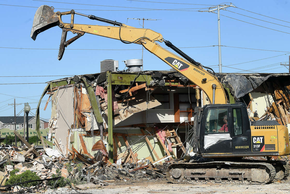 The former home of Clay Dugas & Associates Law Firm at Wall and Park Streets is being demolished. Photo made Tuesday, August 2, 2022. Kim Brent/The Enterprise