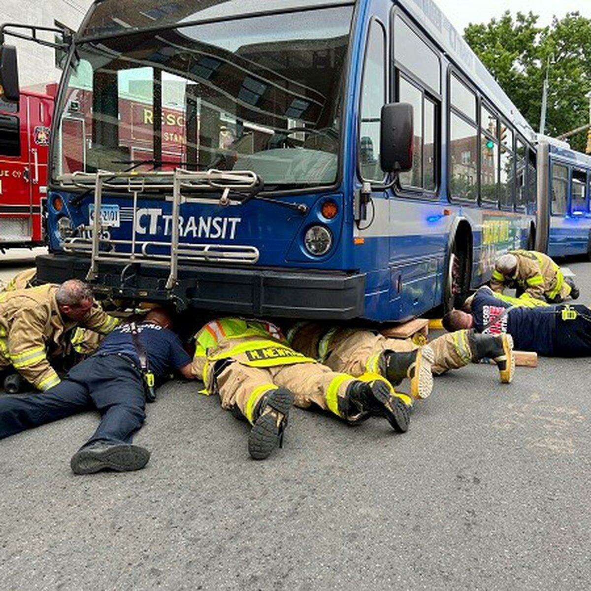 Stamford firefighters freed a woman from under a Connecticut Transit Bus at the intersection of Broad and Atlantic Streets on July 5, 2022.