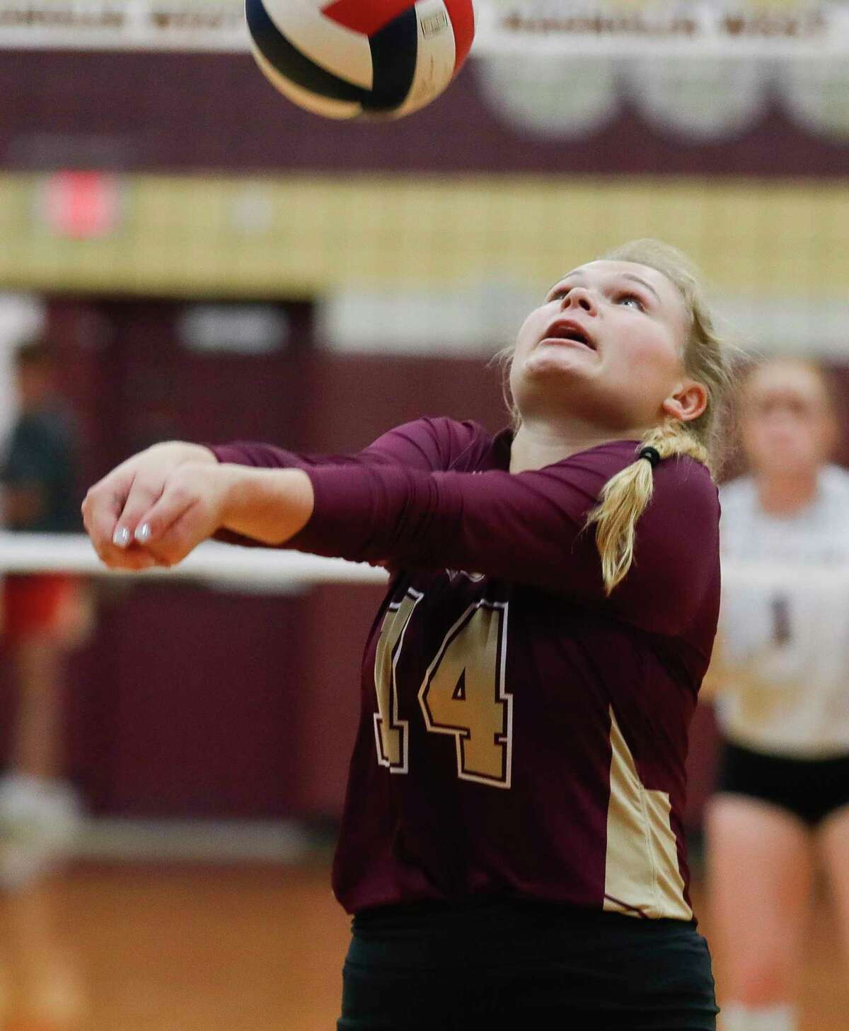 Magnolia West’s Kassidy Johnson (14) returns a hit during the first set of a District 19-5A high school volleyball match at Magnolia West High School, Tuesday, Sept. 21, 2021, in Magnolia.