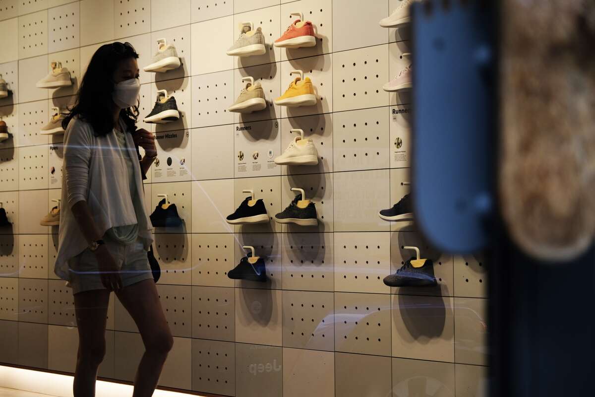 People shop at an Allbirds store, a maker of sustainable shoes, in lower Manhattan on Aug. 31, 2021, in New York.