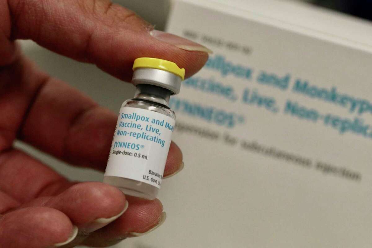 Jonathan Parducho, a pharmacist, holds a dose of the Jynneos vaccine for monkeypox in the vaccine hub at Zuckerberg San Francisco General Hospital on Friday, July 29, 2022, in San Francisco. The vaccine has not yet been approved for children. (Lea Suzuki/San Francisco Chronicle via AP)