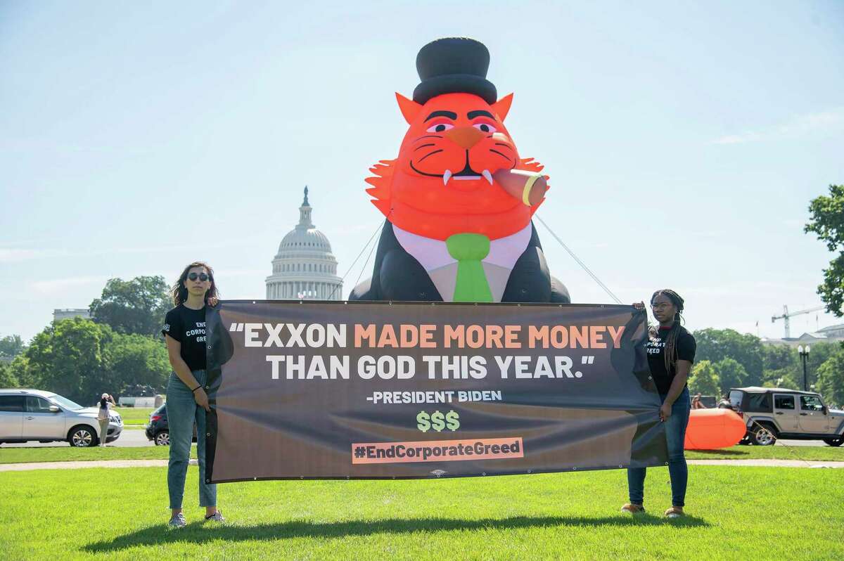 With gas prices near all-time highs, activists protest against record profits by Exxon and other oil companies in front of the Capitol on Wednesday, July 13, 2022 in Washington.