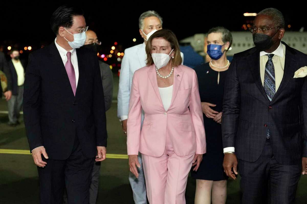 U.S. House Speaker Nancy Pelosi, center, arrives in Taipei, Taiwan, on Tuesday, Aug. 2, 2022, with China having warned of unspecified actions it might take in response. Taiwan semiconductor makers accounted for 40 percent of the second-quarter revenue for ASML, which is in the midst of a big expansion of its Wilton, Conn. plant that makes lithography machines to etch circuitry on chips. (Taiwan Ministry of Foreign Affairs via AP)