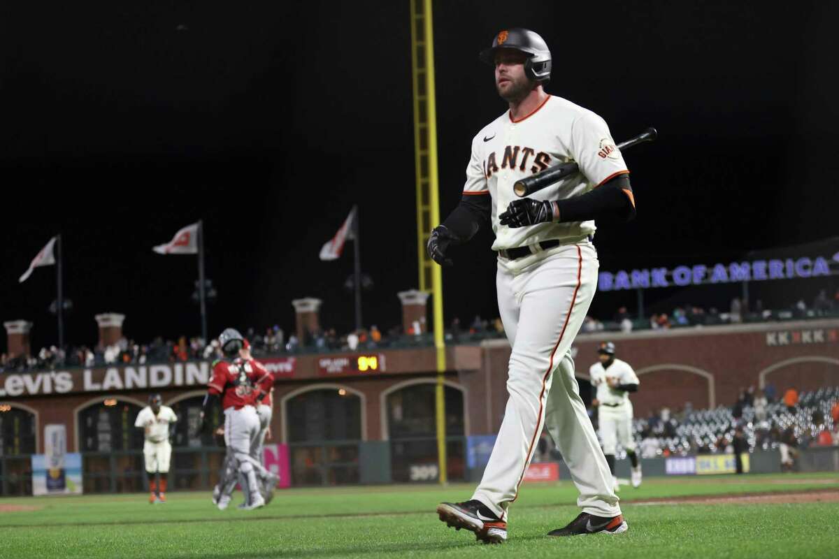 San Francisco Giants’ Darin Ruf rwalks back to the dugout after striking out to end 4-3 loss to Arizona Diamondbacks in MLB game at Oracle Park in San Francisco, Calif., on Monday, July 11, 2022.