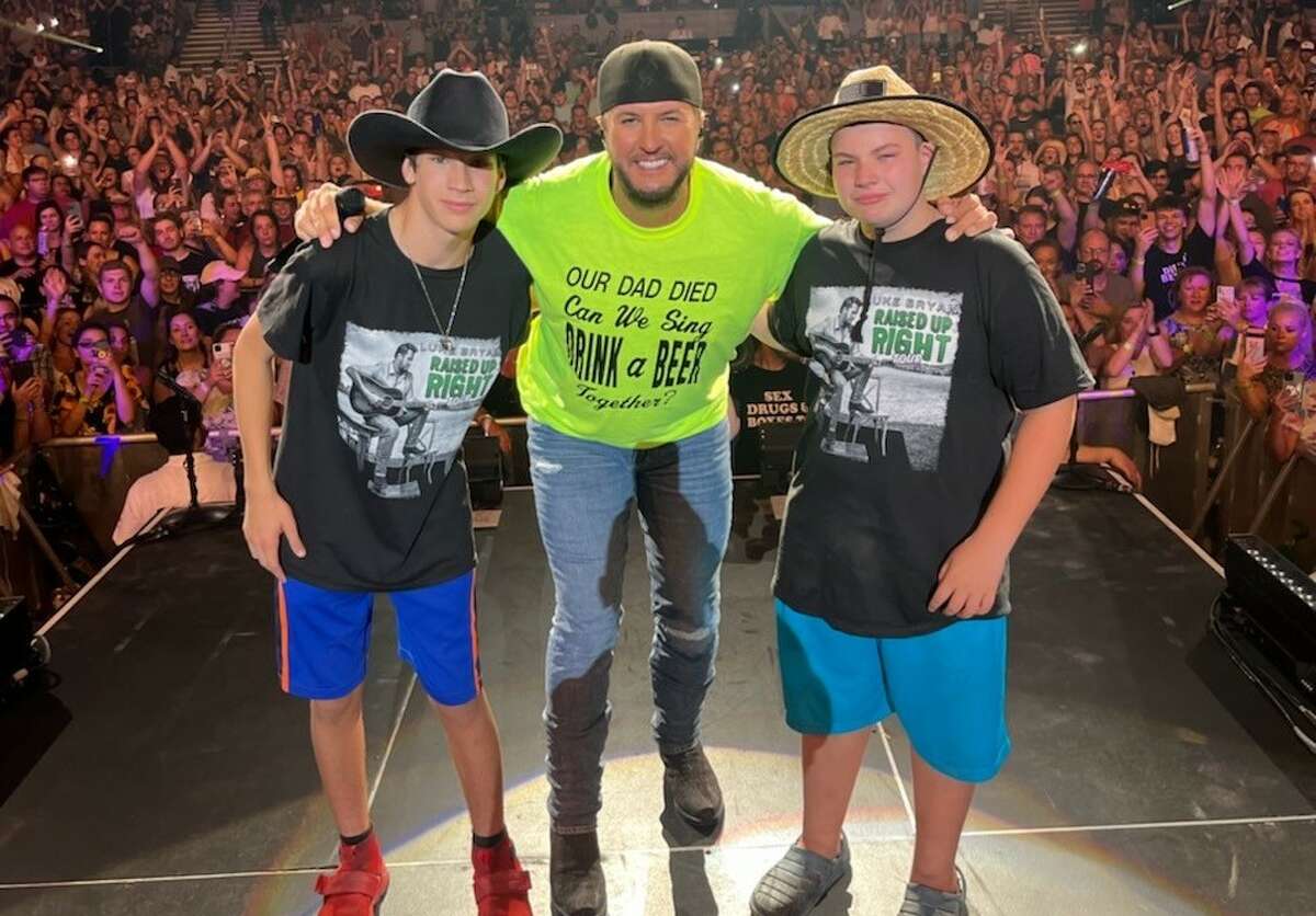 Stacy Sicari's youngest sons sang "Drink a Beer" onstage with Luke Bryan at the singer's concert in Hartford's Xfinity Theatre.