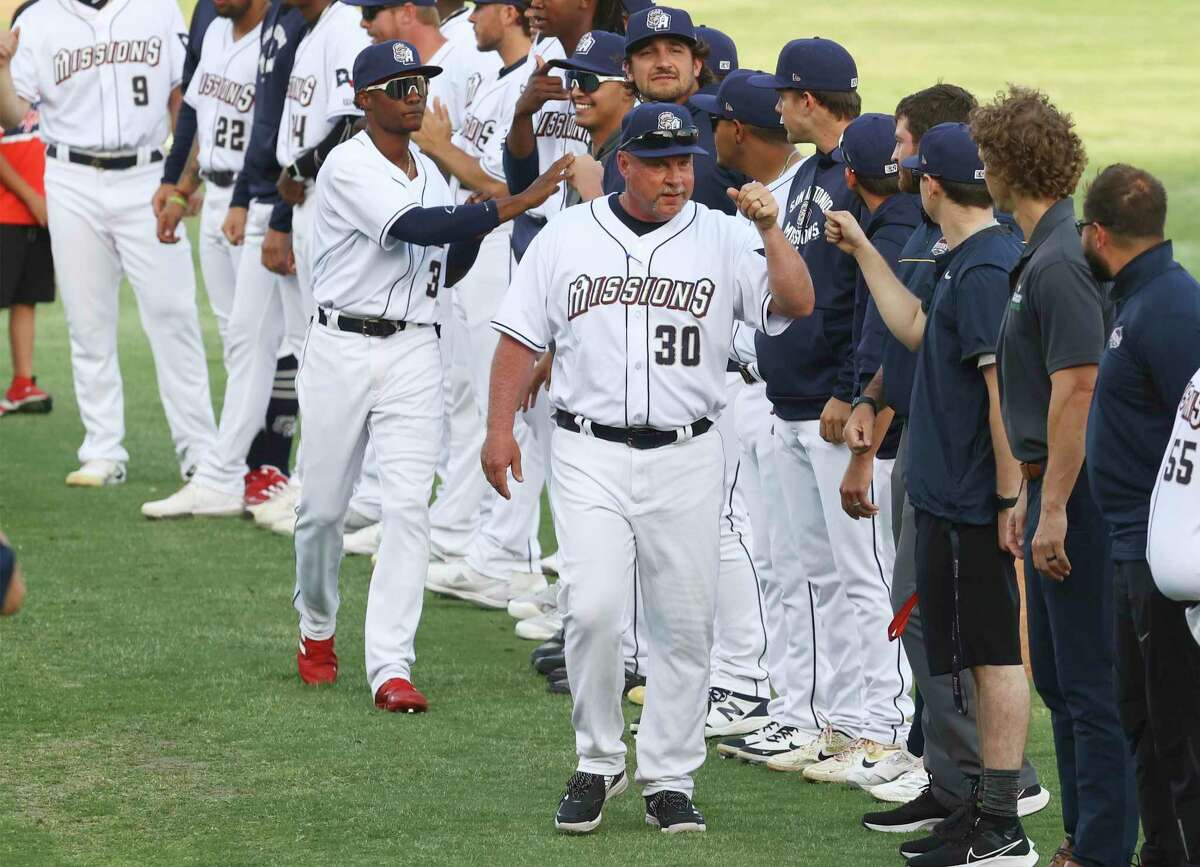 San Antonio Missions' manager Phillip Wellman (30) greets his team at their home opener at Wolff Stadium against the Frisco Roughriders on Tuesday, Apr. 12, 2022.