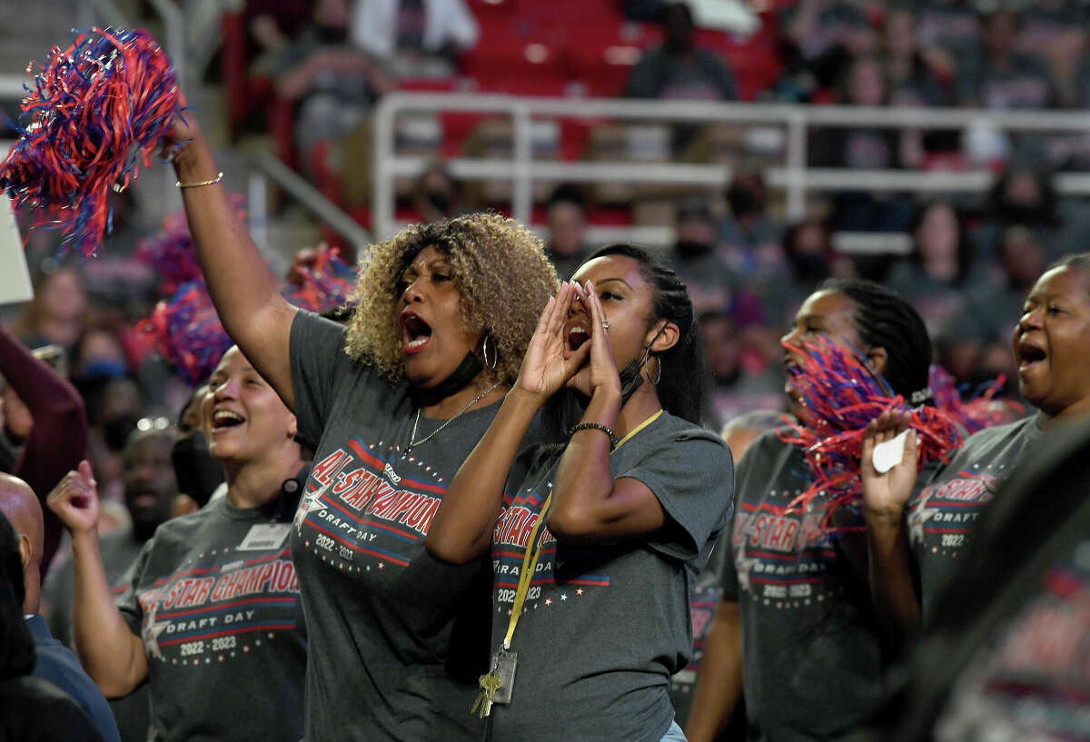 Staff from Beaumont United cheer along as their campus is acknowledged during the Beaumont ISD annual convocation Tuesday at the Montagne Center. Photo made Tuesday, August 2, 2022. Kim Brent/The Enterprise