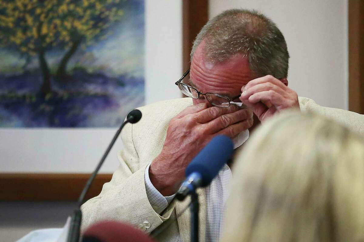 Neil Heslin, father of 6-year-old Sandy Hook shooting victim Jesse Lewis, becomes emotional during his testimony during the trial for Alex Jones, Tuesday Aug. 2, 2022, at the Travis County Courthouse in Austin. Jones has been found to have defamed the parents of a Sandy Hook student for calling the attack a hoax. (Briana Sanchez/Austin American-Statesman via AP, Pool)