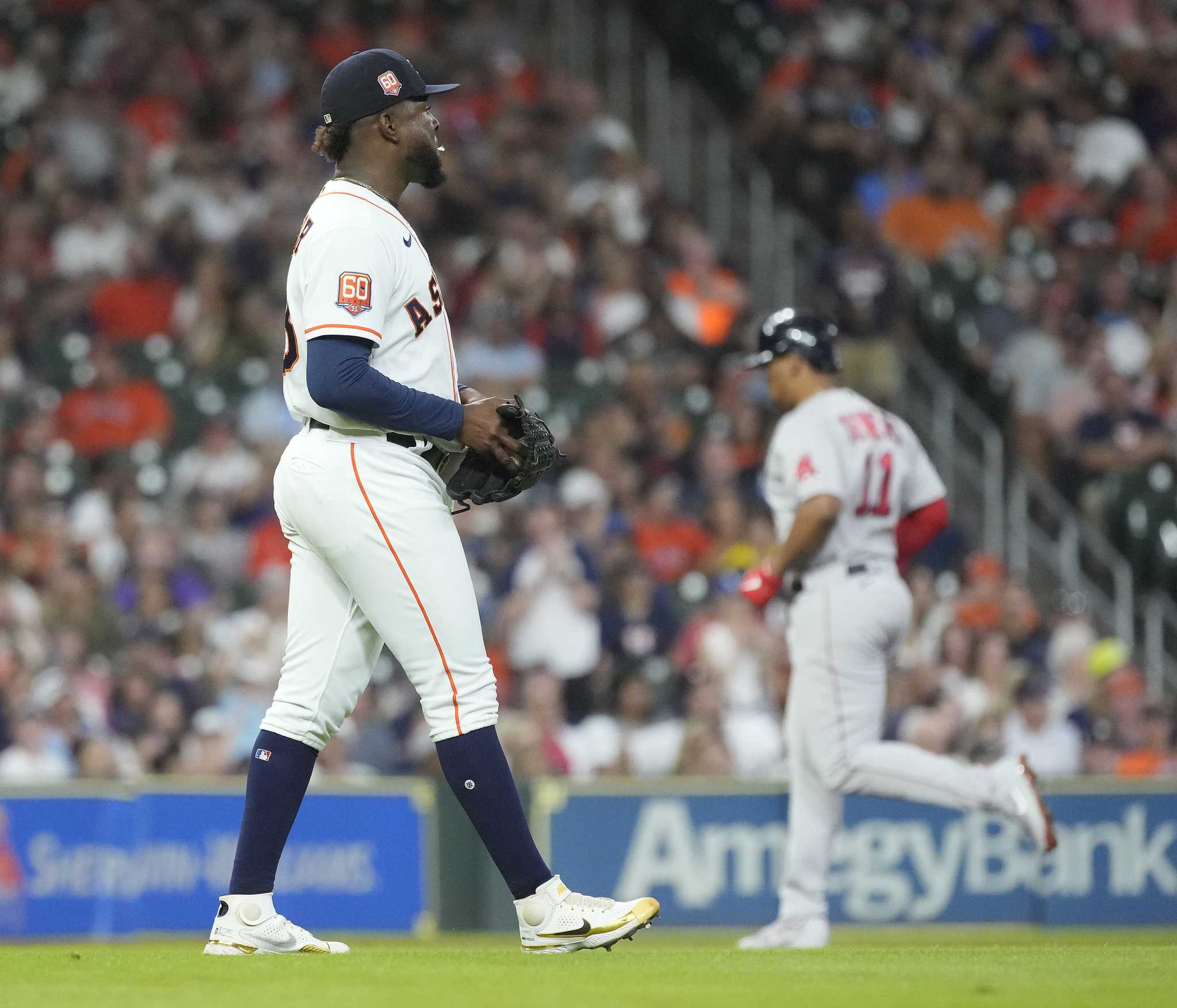 Rafael Devers of the Boston Red Sox reacts after hitting a single