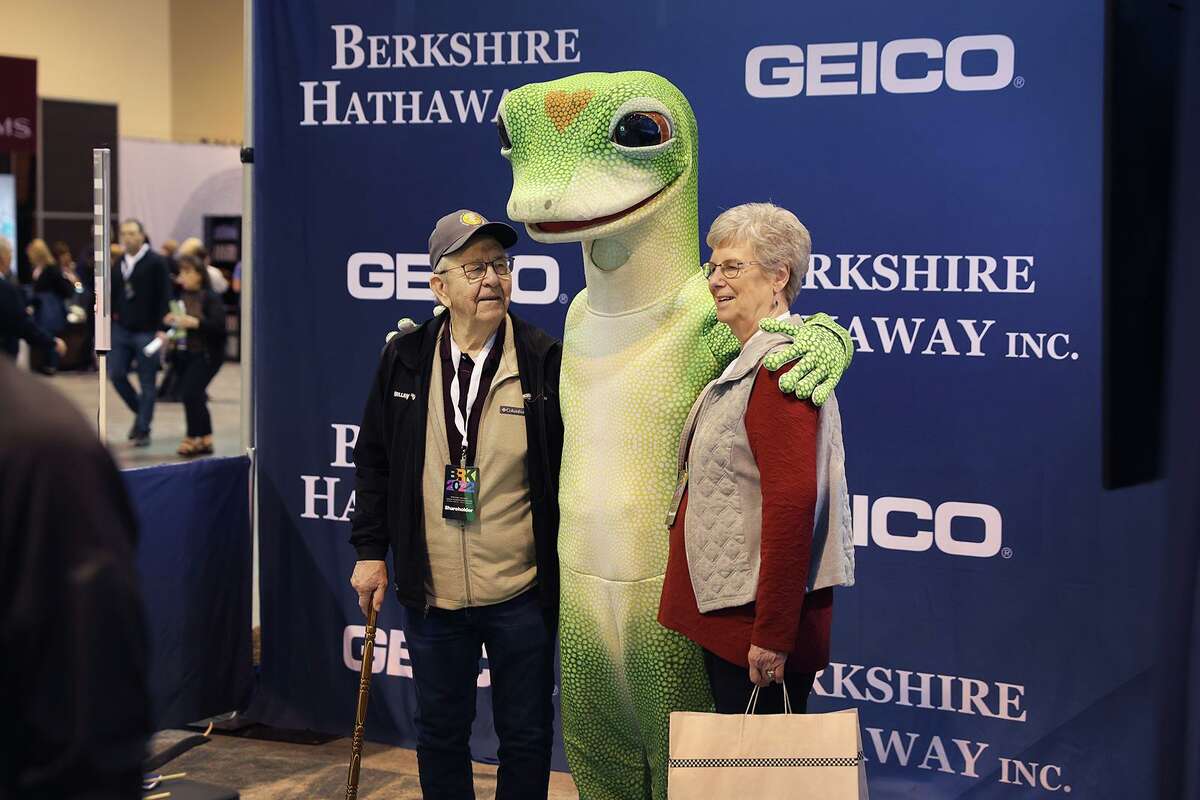 Shareholders pose for a picture with a Geico mascot at the Berkshire Hathaway annual shareholder's meeting on April 30, 2022, in Omaha, Nebraska.