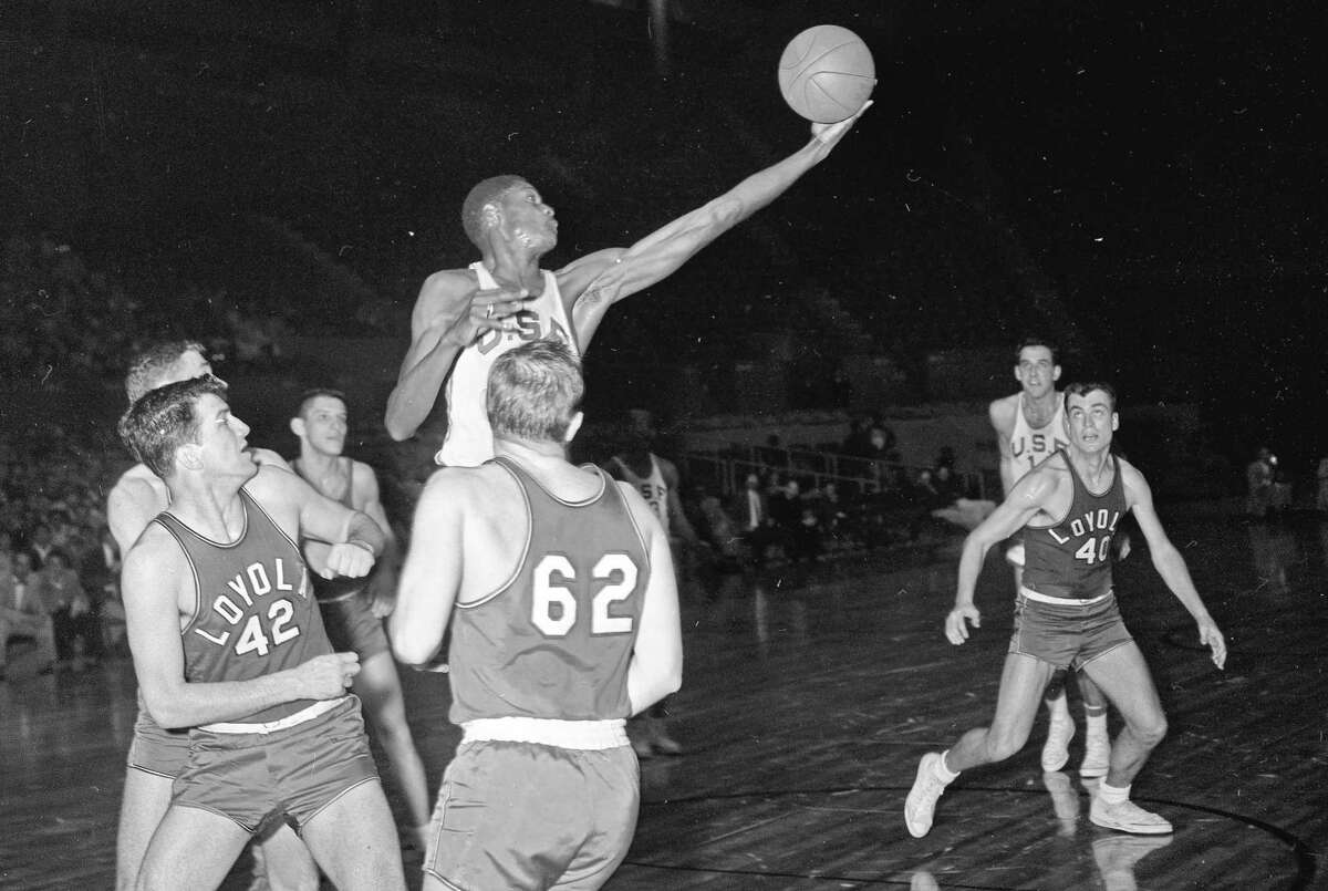 SAN FRANCISCO, CA - FEBRUARY 4: The University of San Francisco's Bill Russell, top left, plays in a game against Loyola of Los Angeles in the opening game of a double-header at the Cow Palace in San Francisco, CA., on February 4, 1955. USF defeated Loyola 65-55 in the game. (Bill Young/San Francisco Chronicle via Getty Images)
