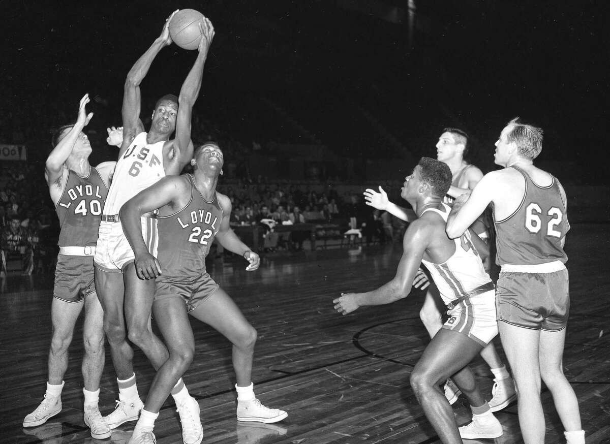 SAN FRANCISCO, CA - FEBRUARY 4: The University of San Francisco's Bill Russell, left, plays in a game against Loyola of Los Angeles in the opening game of a double-header at the Cow Palace in San Francisco, CA., on February 4, 1955. USF defeated Loyola 65-55 in the game. (Bill Young/San Francisco Chronicle via Getty Images)