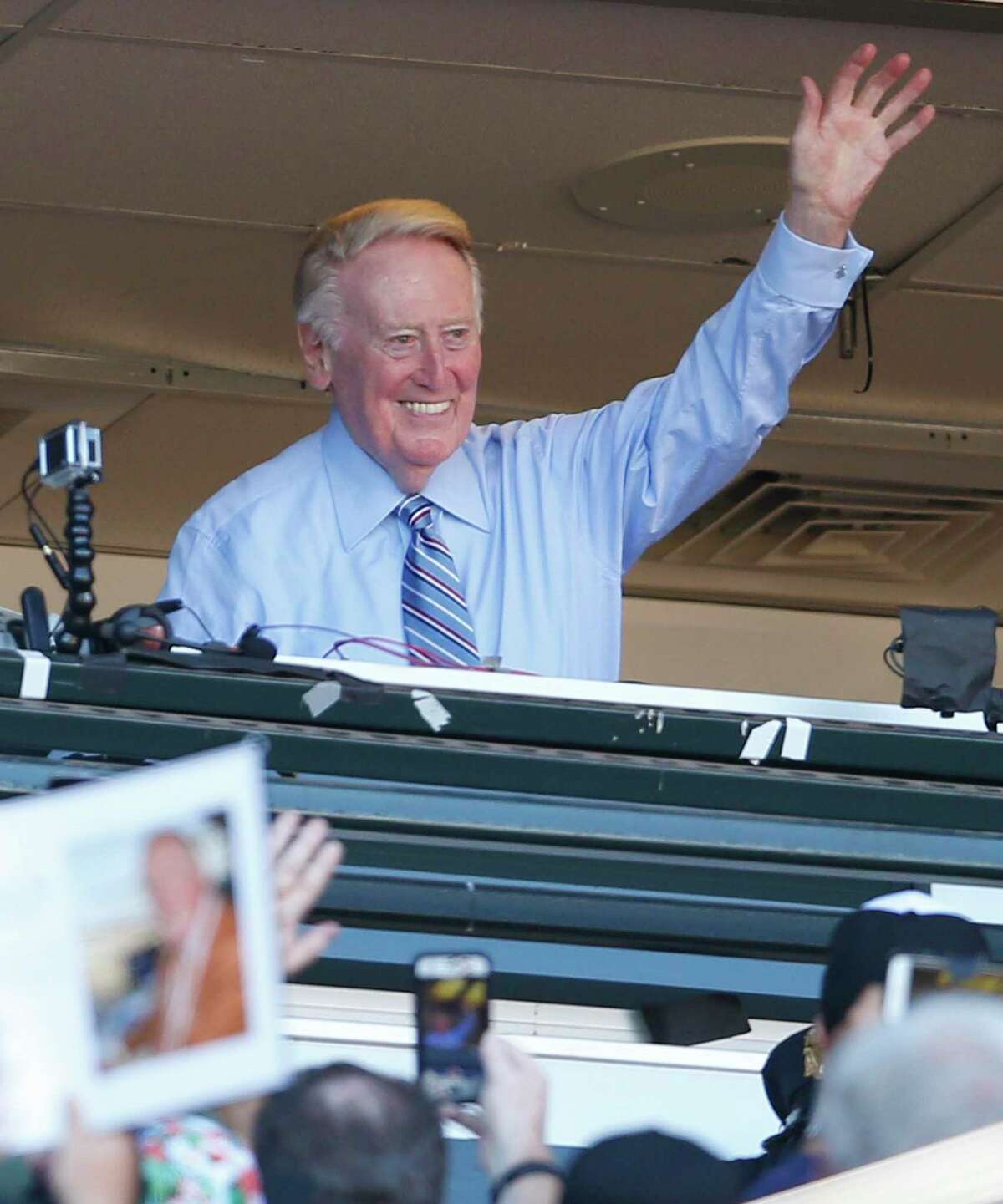 Los Angeles Dodgers' legendary announcer Vin Scully acknowledges the crowd during 7th inning stretch in Scully's final regular season broadcast during Dodgers' MLB game against San Francisco Giants at AT&T Park in San Francisco, Calif., on Sunday, October 2, 2016.