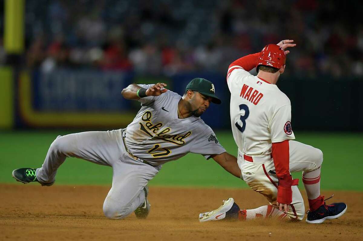 ANAHEIM, CA - AUGUST 02: Elvis Andrus #17 of the Oakland Athletics tags out Taylor Ward #3 of the Los Angeles Angels trying to steal second base in the sixth inning at Angel Stadium of Anaheim on August 2, 2022 in Anaheim, California. (Photo by John McCoy/Getty Images)
